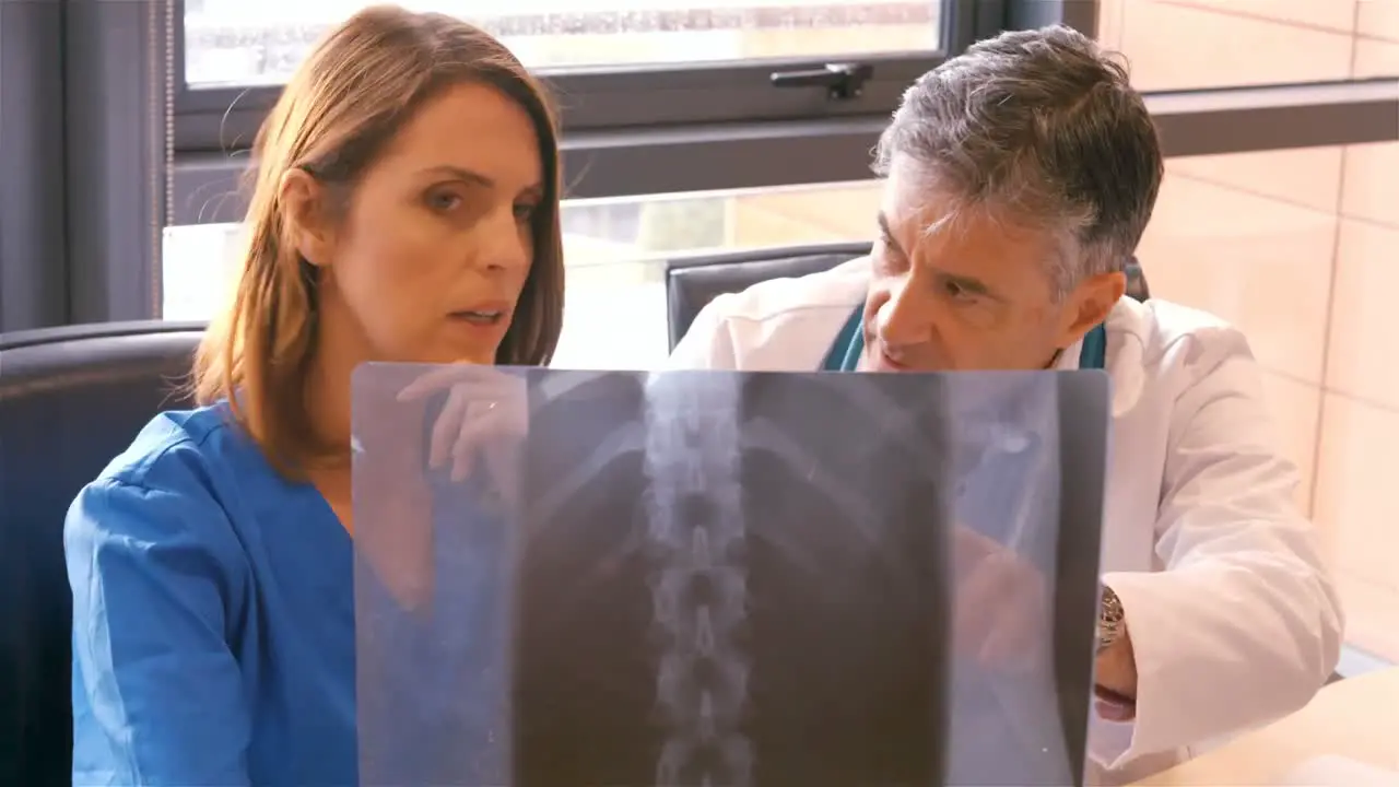 Doctor and nurse examining x-ray