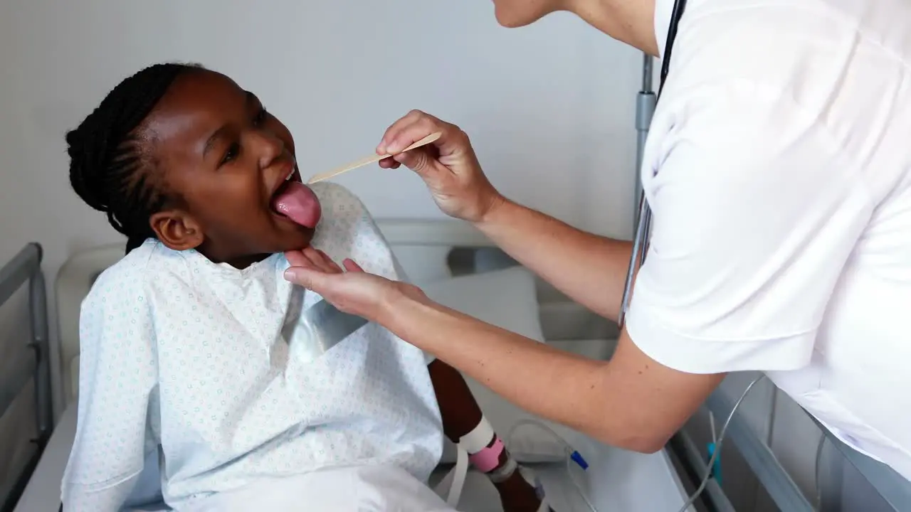 Female doctor examining a sick girl