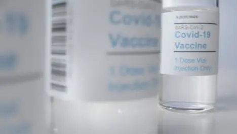 Sliding Extreme Close Up Shot Past Multiple Vials of Covid Vaccine with Right Copy Space