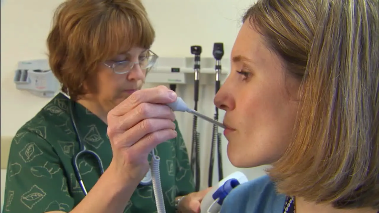 A Doctor Treats A Patient For Flu Like Symptoms 1