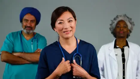 Three Approachable Medical Professionals Smiling Portrait