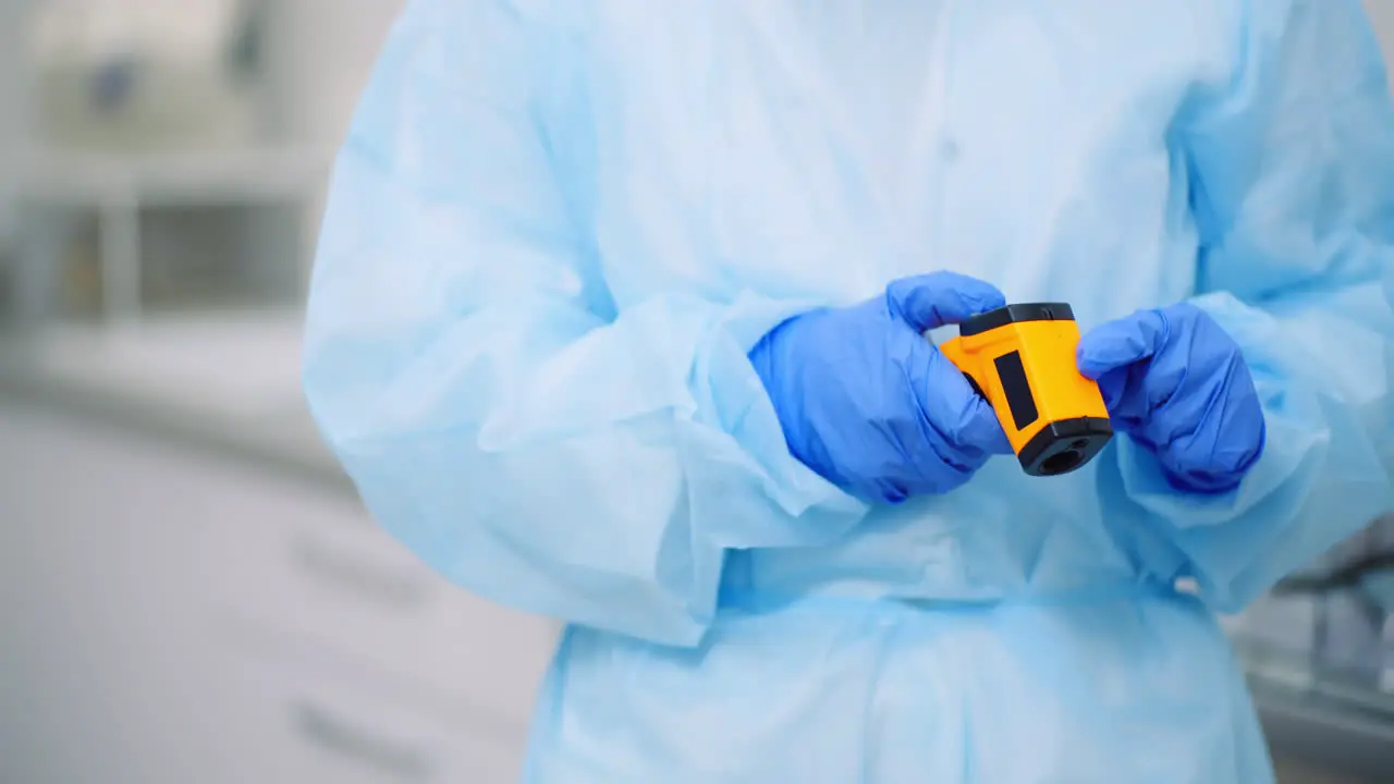 Doctor Measuring Patient Temperature At Health Care Clinic 7