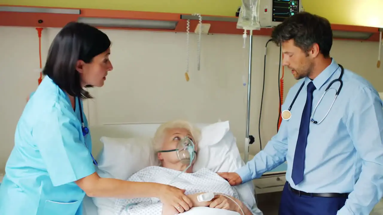 Female doctor putting oxygen mask on patient