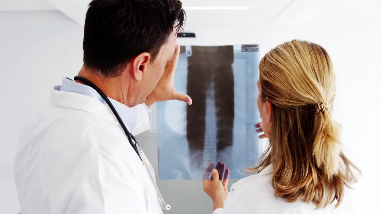 Doctors checking x-ray report