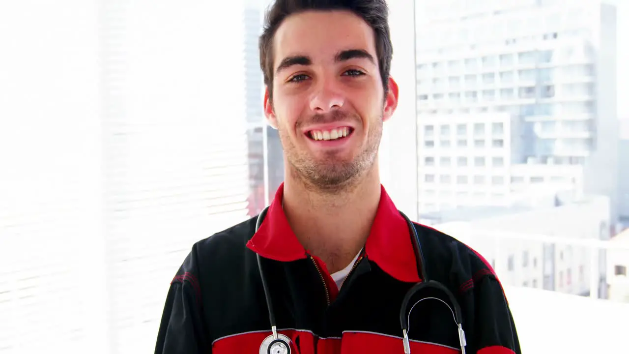 Portrait of male doctor standing with arms crossed