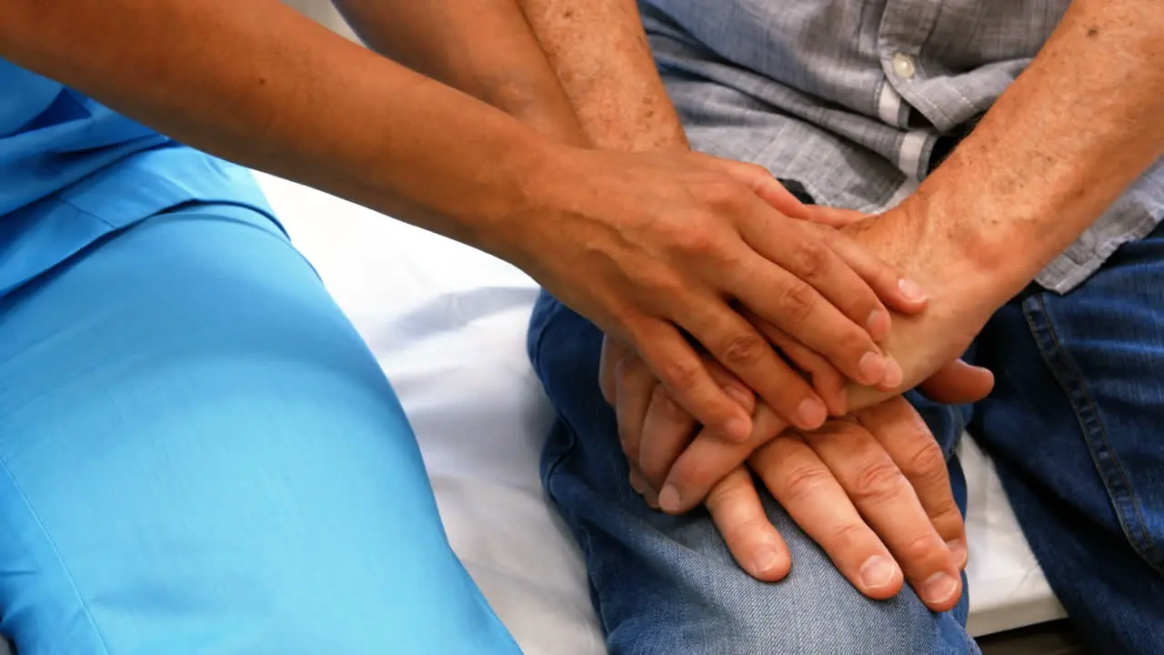 Close-up of female doctor consoling a patient