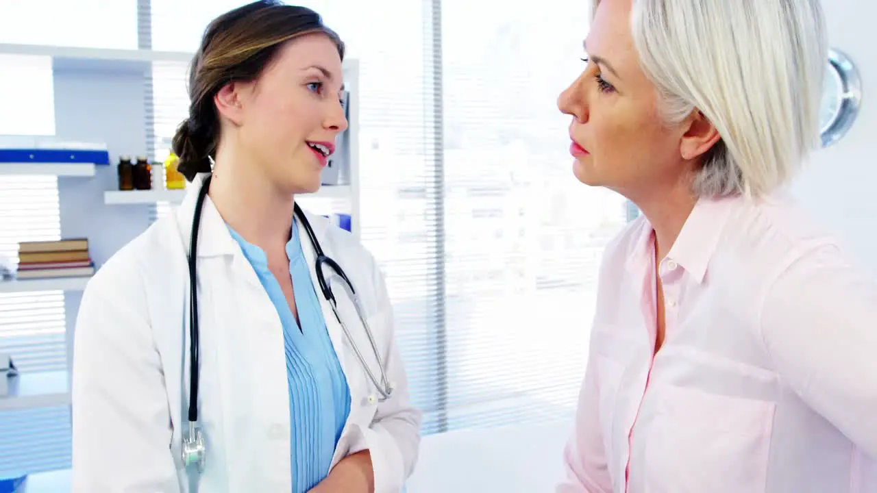 Female doctor discussing over medical report with patient