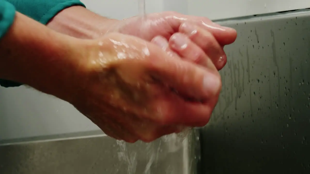 Close-up of surgeons washing his hands