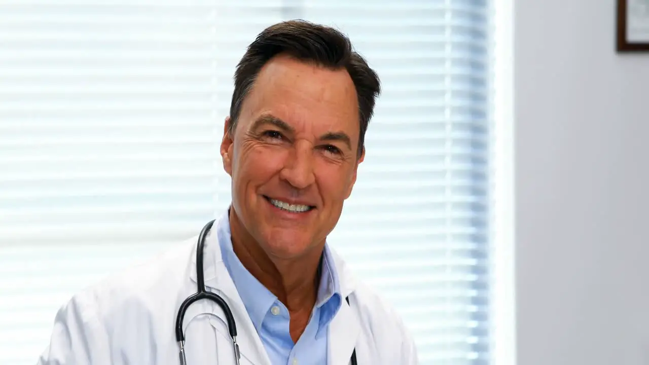 Portrait of doctor sitting in hospital