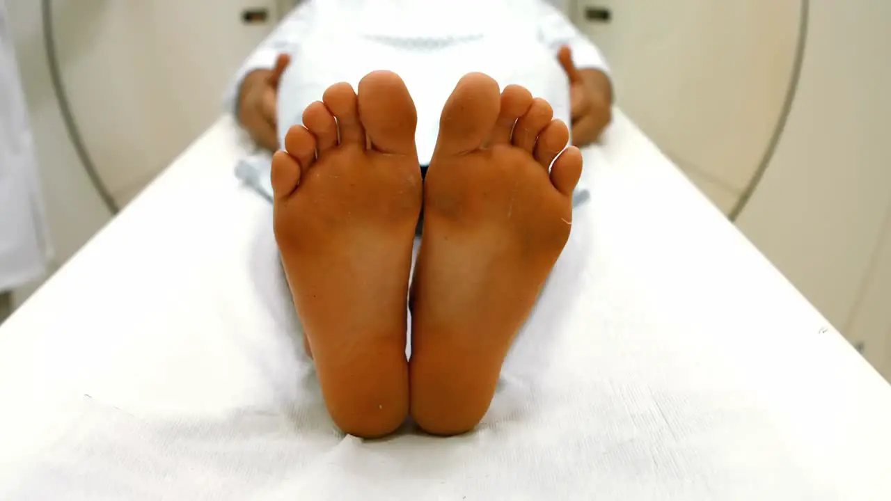 A male patient is entering into an mri machine