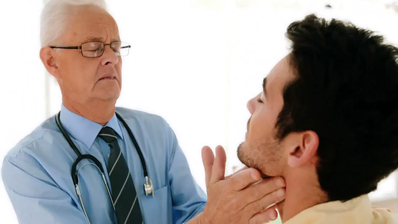 Doctor examining male patient