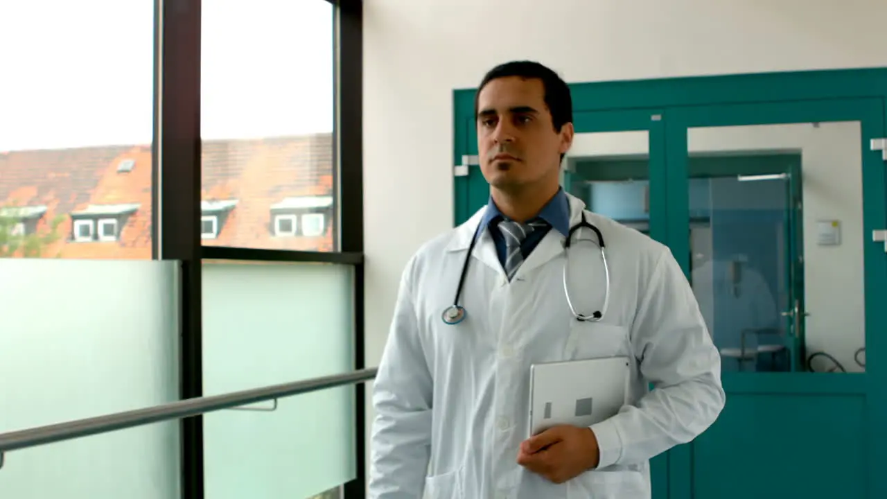 Male doctor holding digital tablet