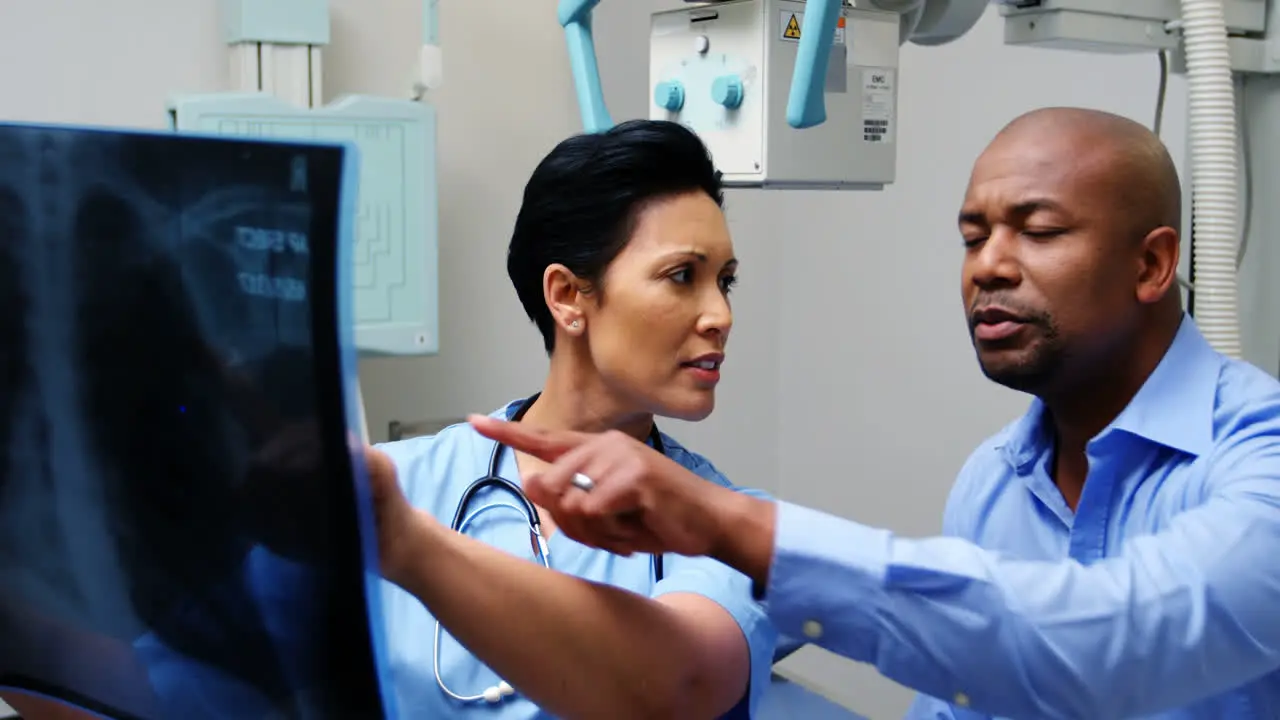 Female doctor discussing x-ray with patient