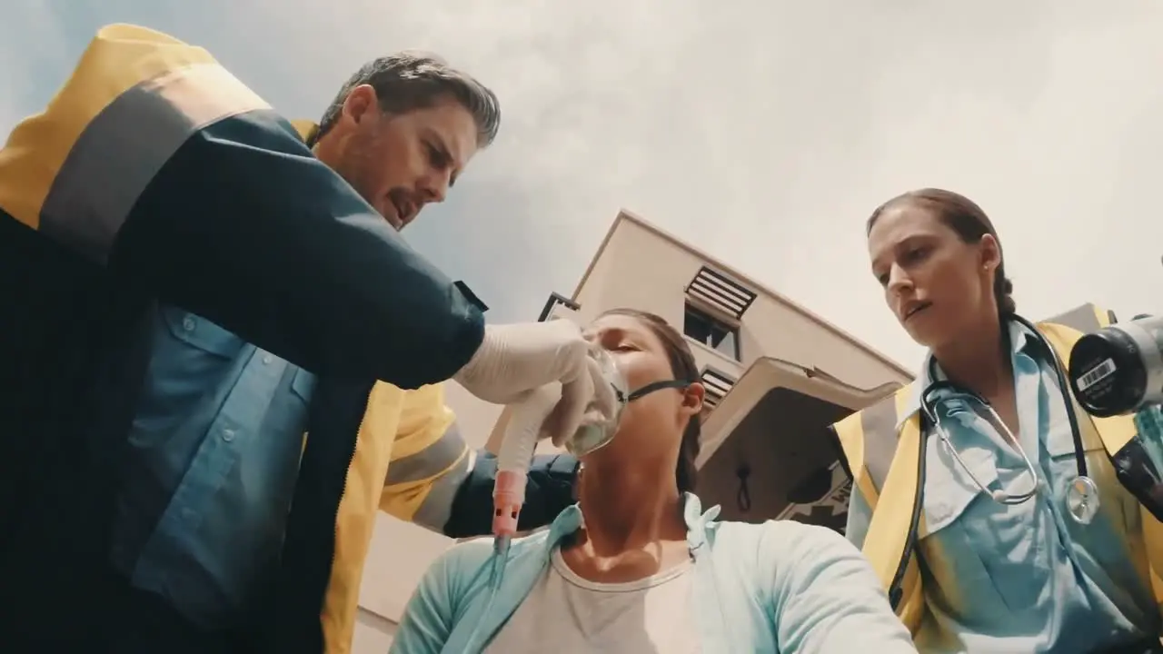 Doctor putting an oxygen mask on patient