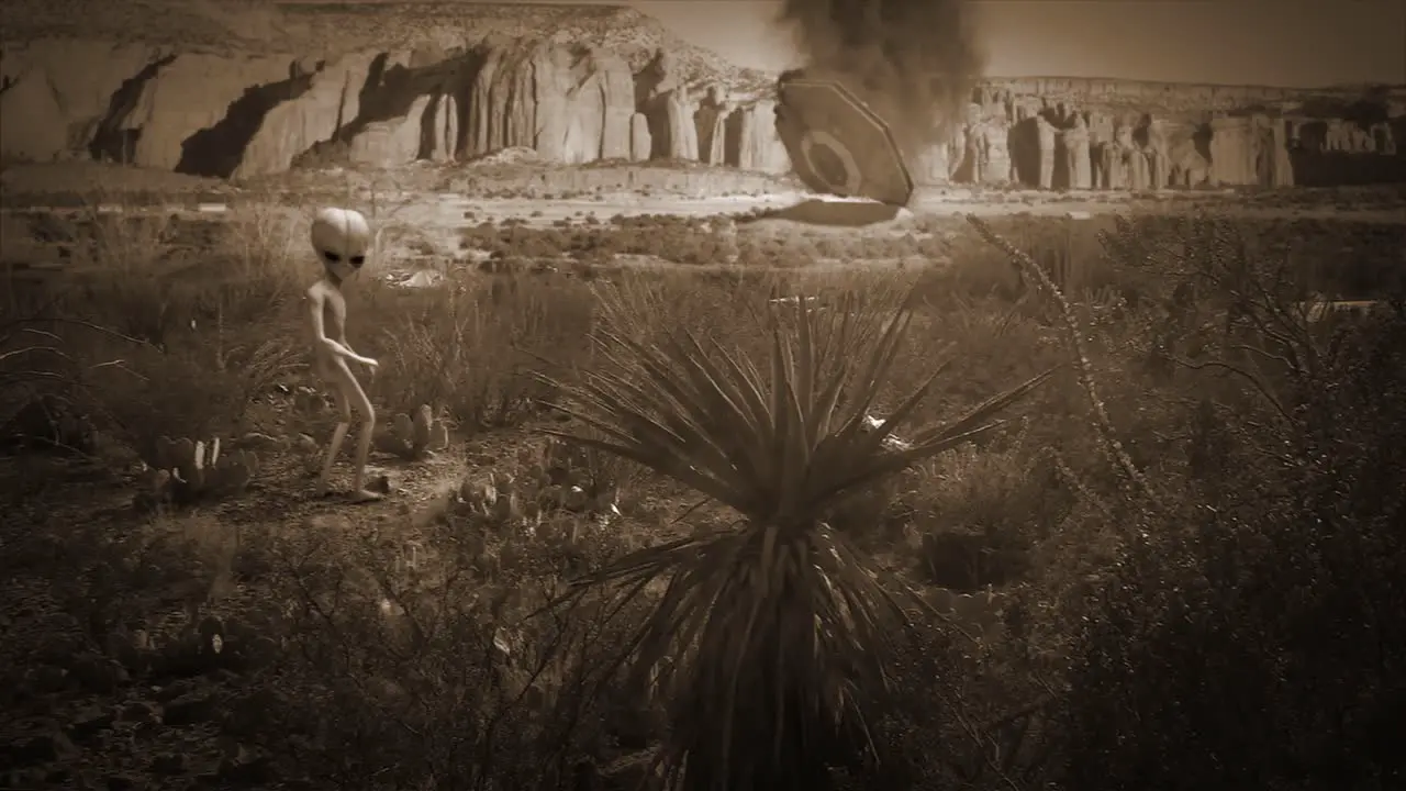 VFX shot of a classic Roswell style flying saucer crashed in flames in the New Mexico desert in the background with a classic little grey alien watching on in sepia color scheme