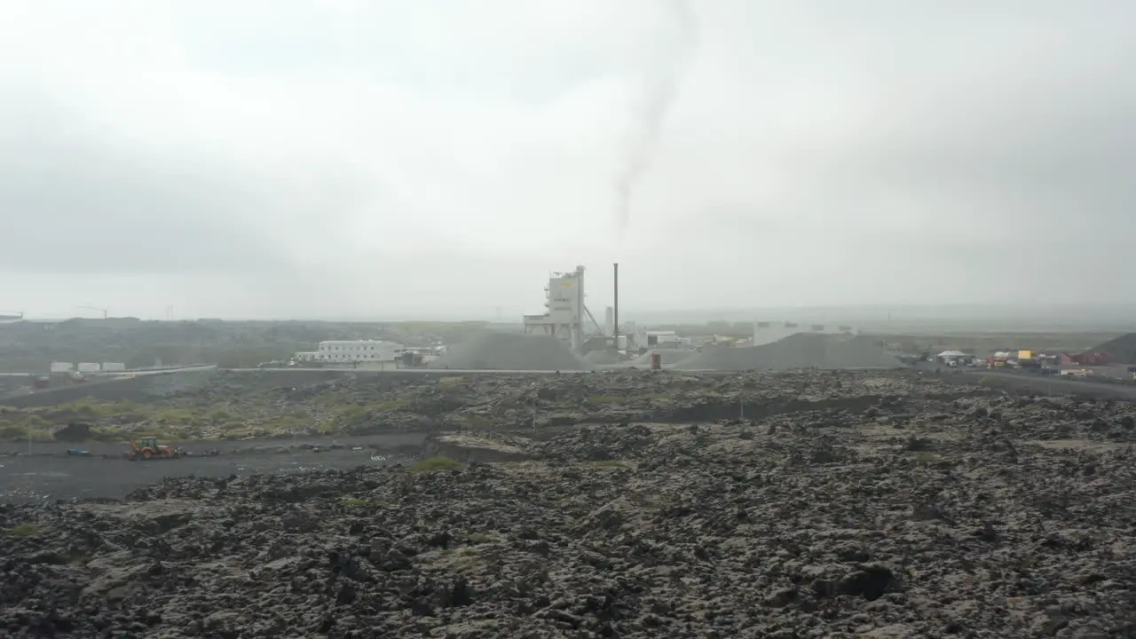 Drone view moving towards Colas industry in Iceland Birds eye view of this industry which is specialized in the production of asphalt