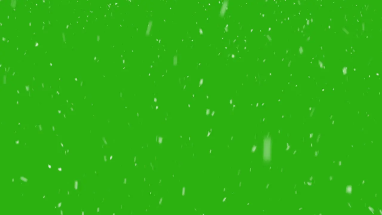 Snowflakes falling chaotic against greenscreen background VFX