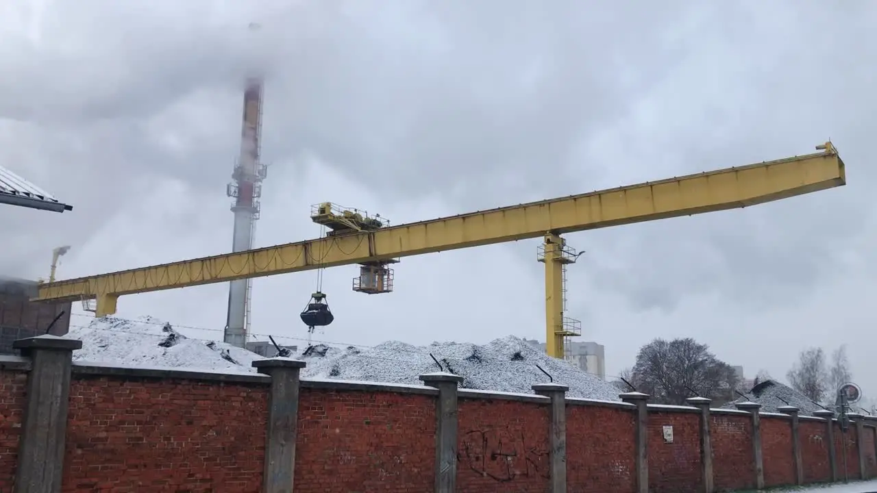 Gantry crane used to transport coal in sugar factory in Malbork Poland on snowy winter day