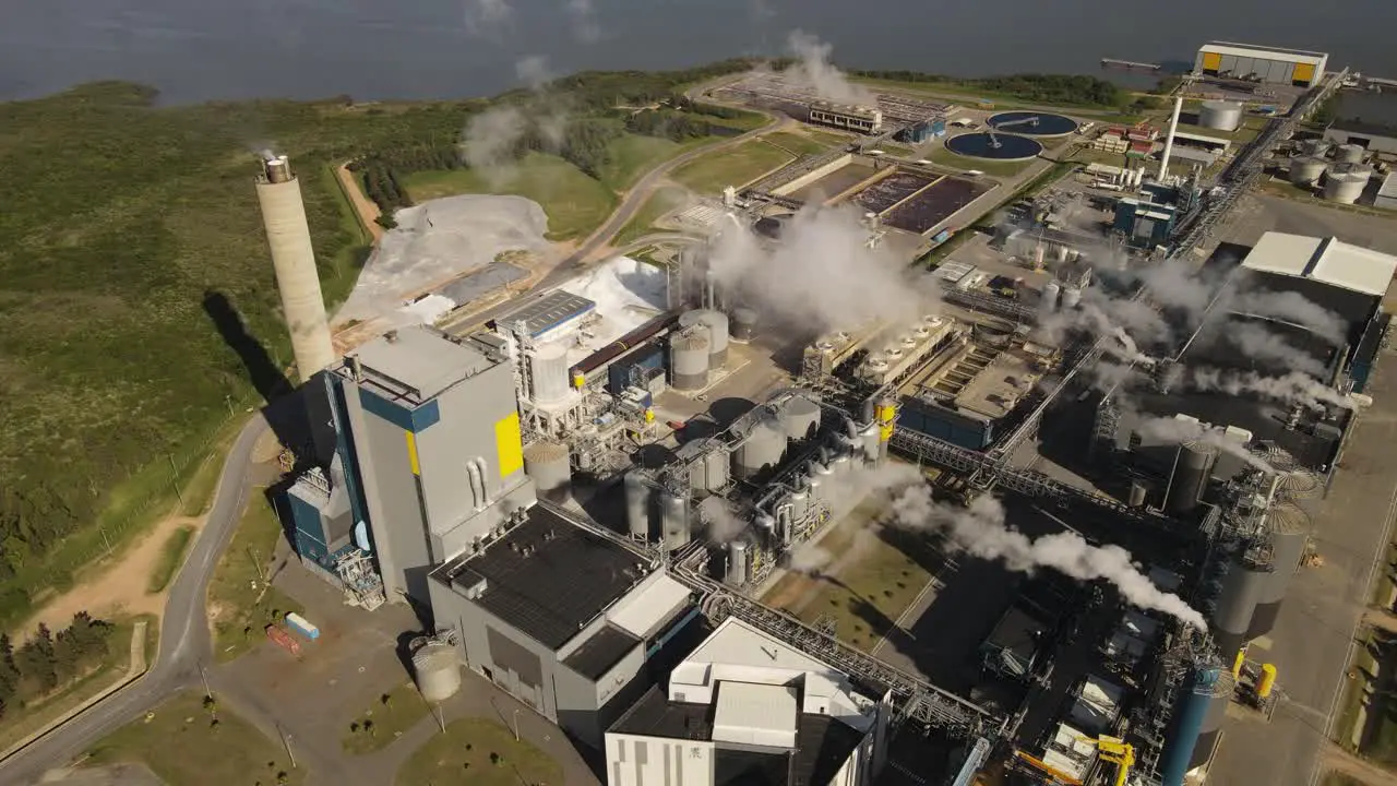 Smoking chimneys of paper mill factory Fray Bentos in Uruguay