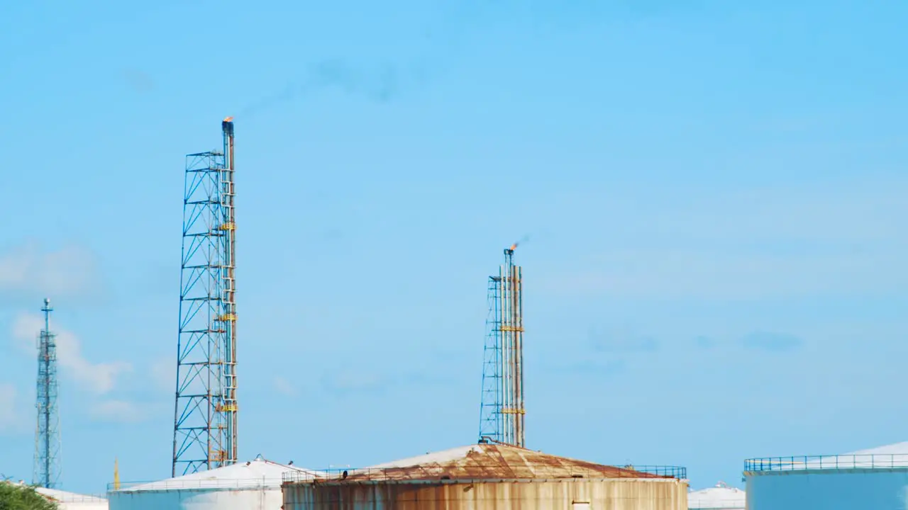 Smoke billowing from smokestacks at oil refinery in Willemstad Curacao