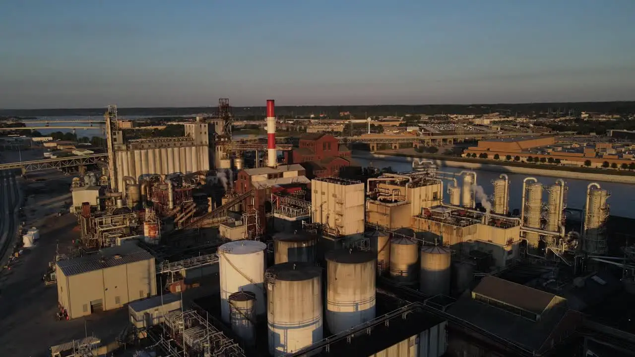 Aerial footage of a complex alcohol production plant at sunset in Peoria Illlinois