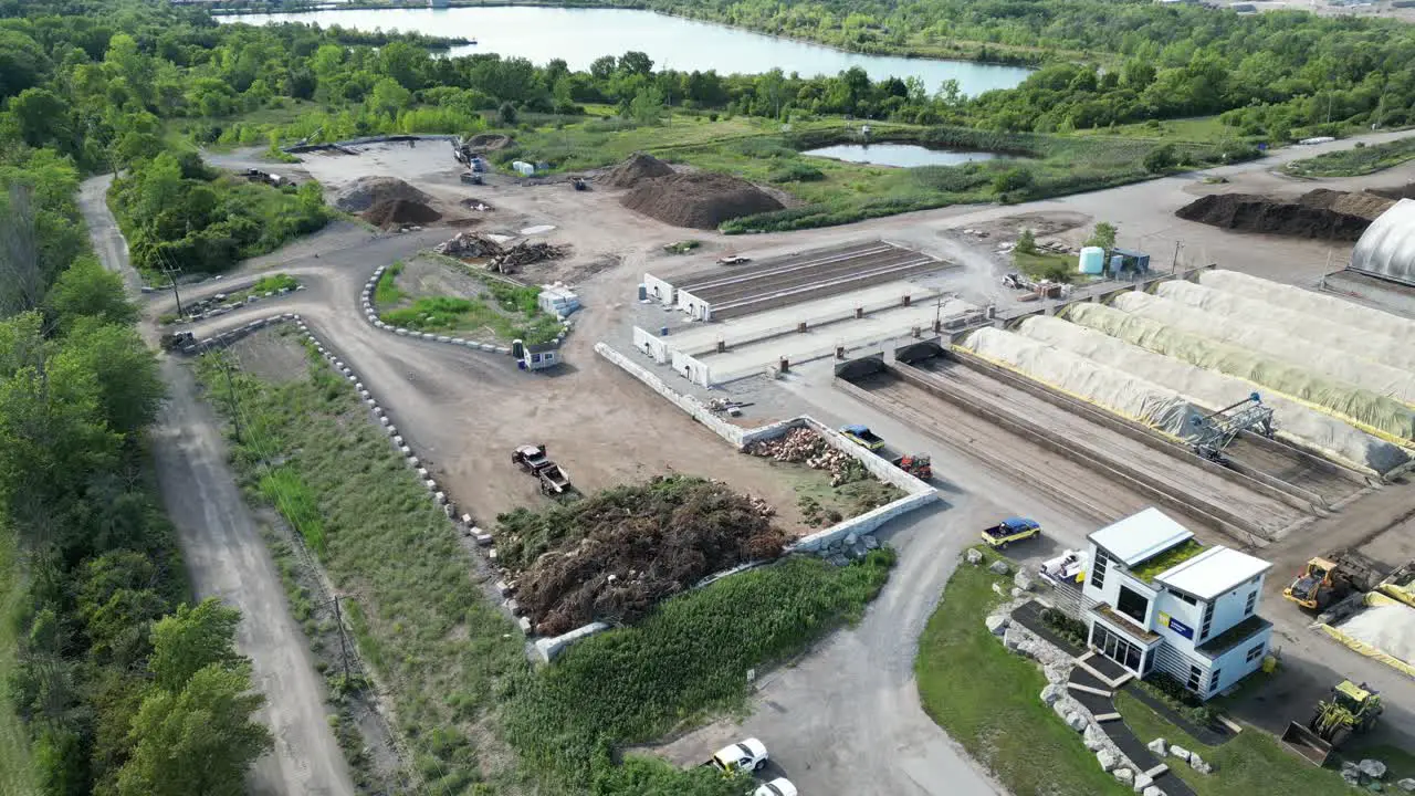 Yard waste disposal pile at garbage centre with covered compost aerial