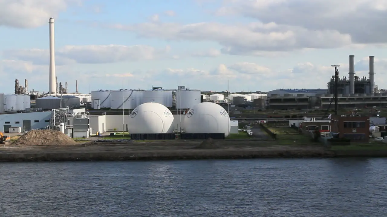 Netherlands Rotterdam refinery globe tanks reverse against stack