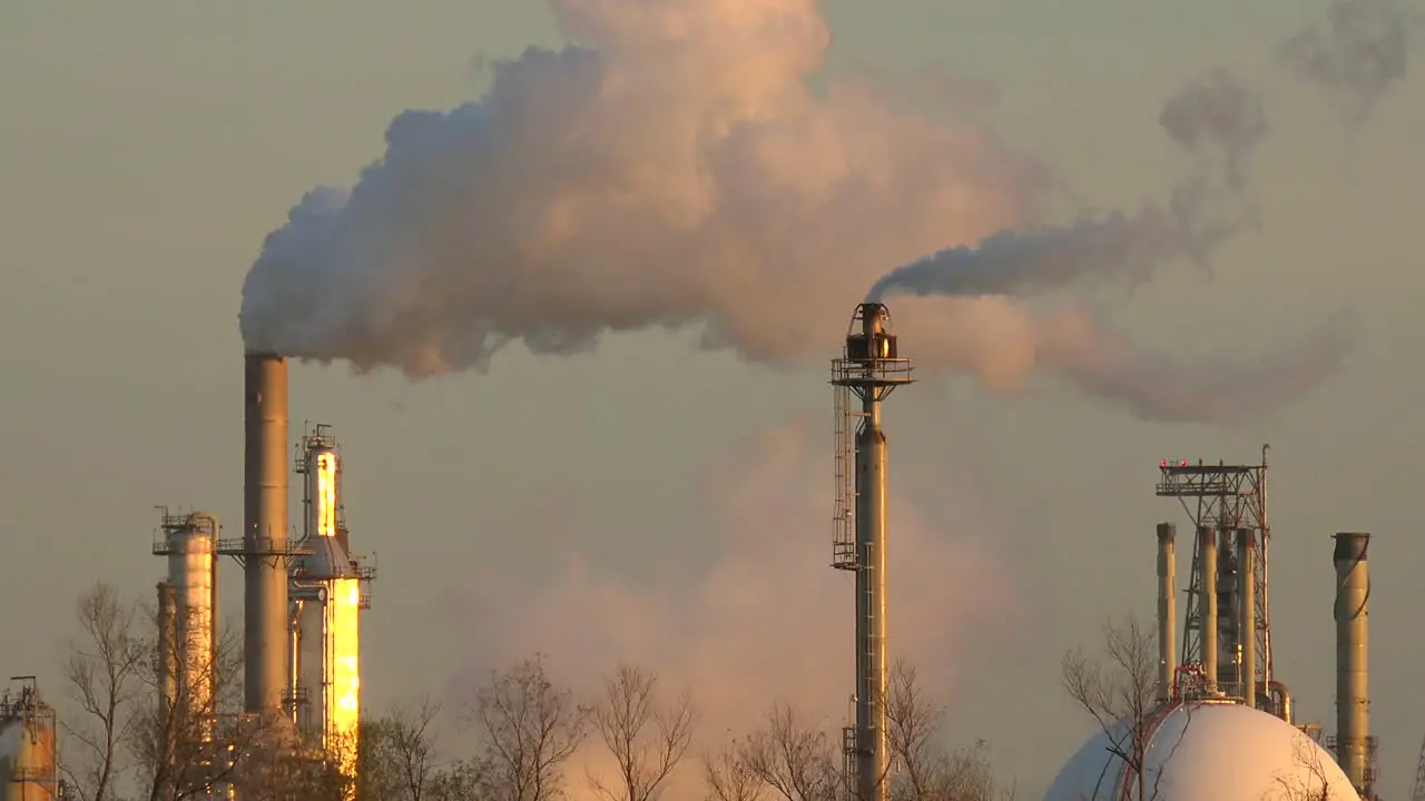 Smokestacks belch pollution into the sky