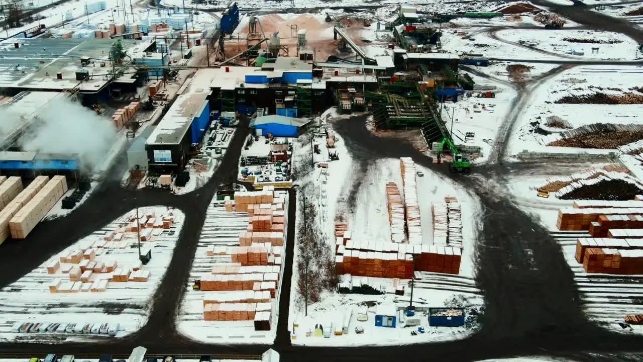 Panoramic aerial view of plywood producing sawmill in winter