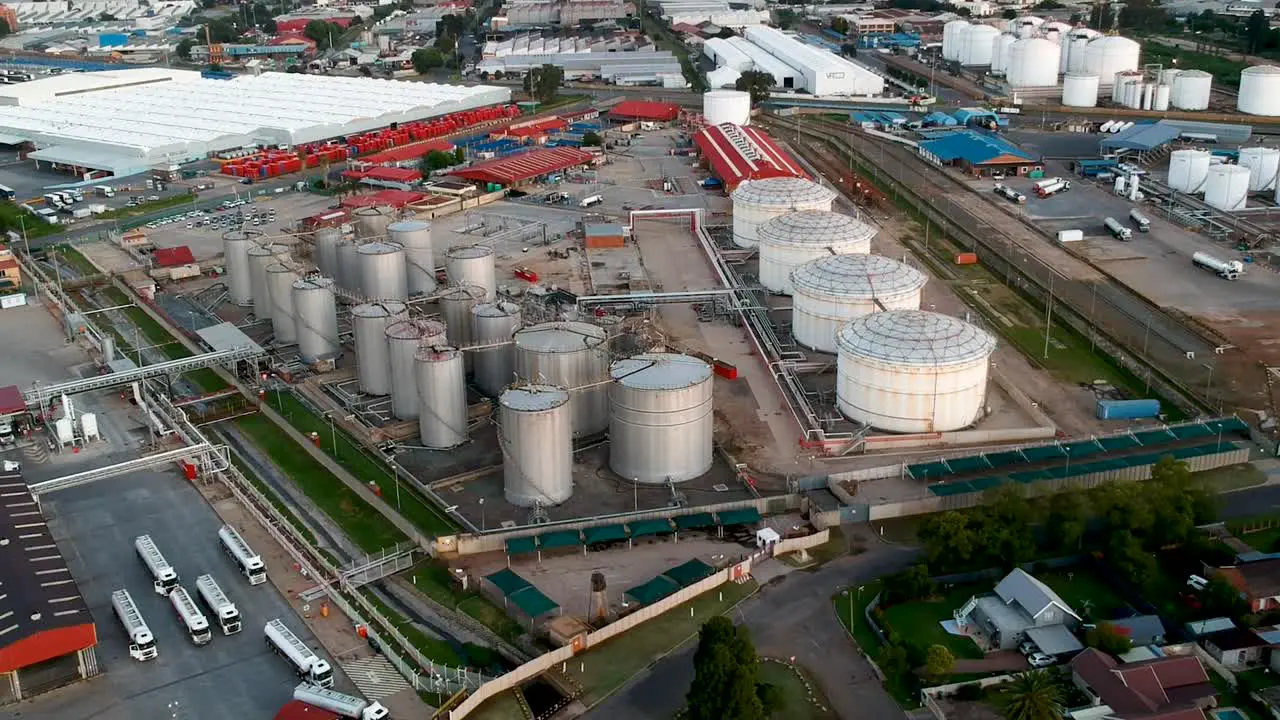 Rising drone view of fuel depot and tankers