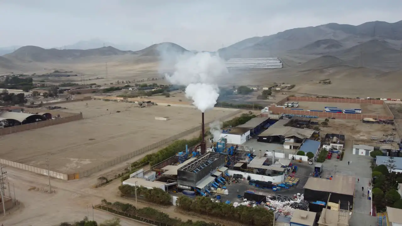 Smoke plume rising out of a factory chimney