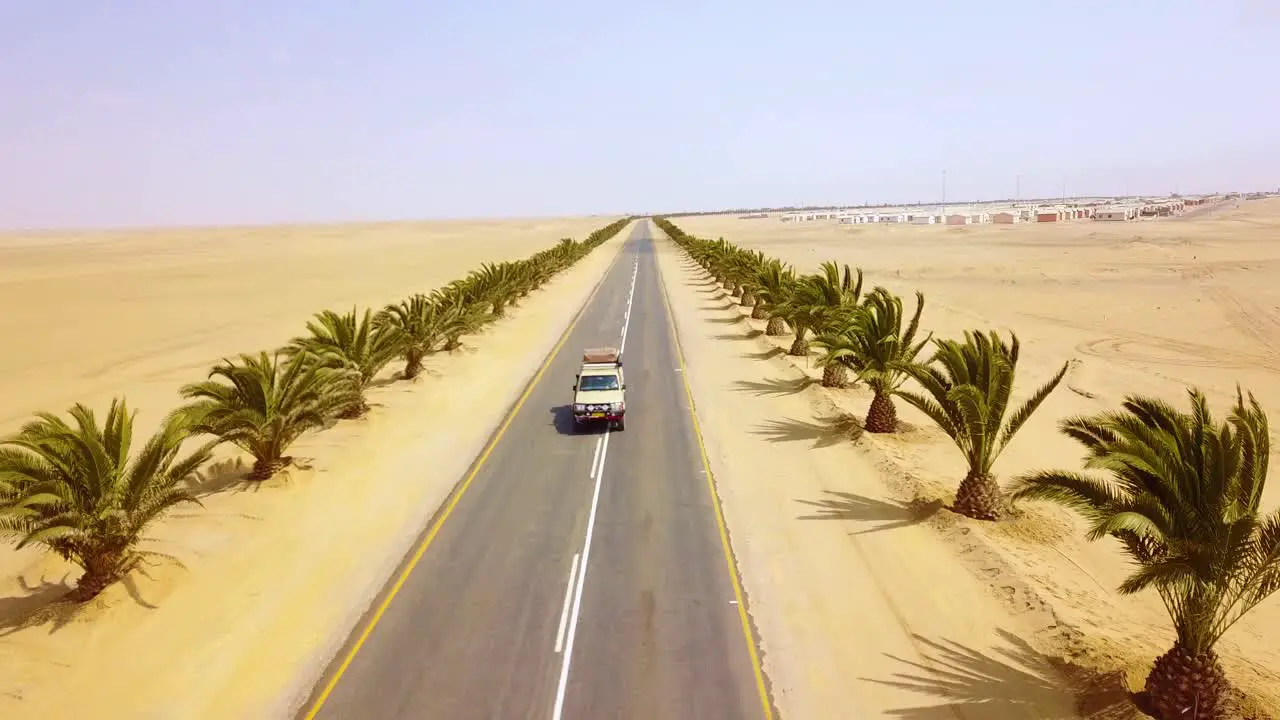 Aerial over a 4 WD jeep on a road near Swakopmund Skeleton Coast namibia Africa