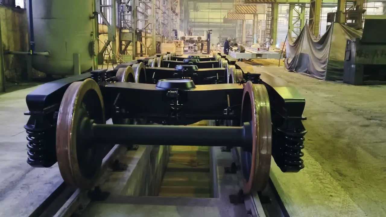 Construction of new metal wagons for train wheels in large factory upwards pan