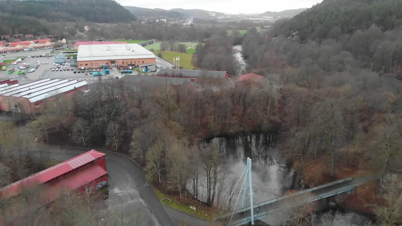 Aerial Shot Of Industrial Buildings And Park With River In A Town During Winter Sweden