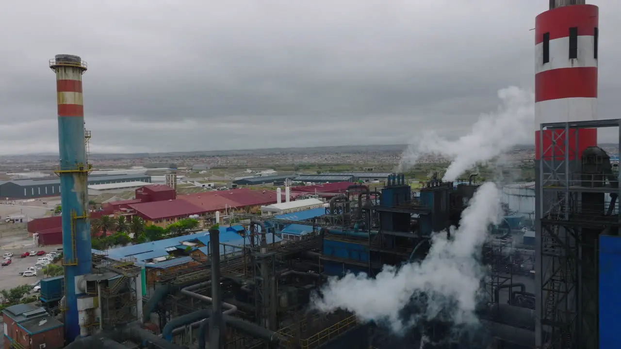 Backwards reveal of industrial site Production factory or heating plant at town Port Elisabeth South Africa