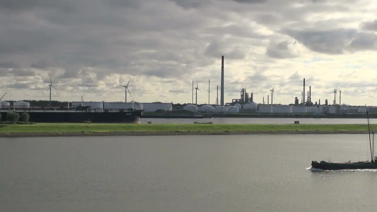 Netherlands Rotterdam ship passes refinery stacks 14