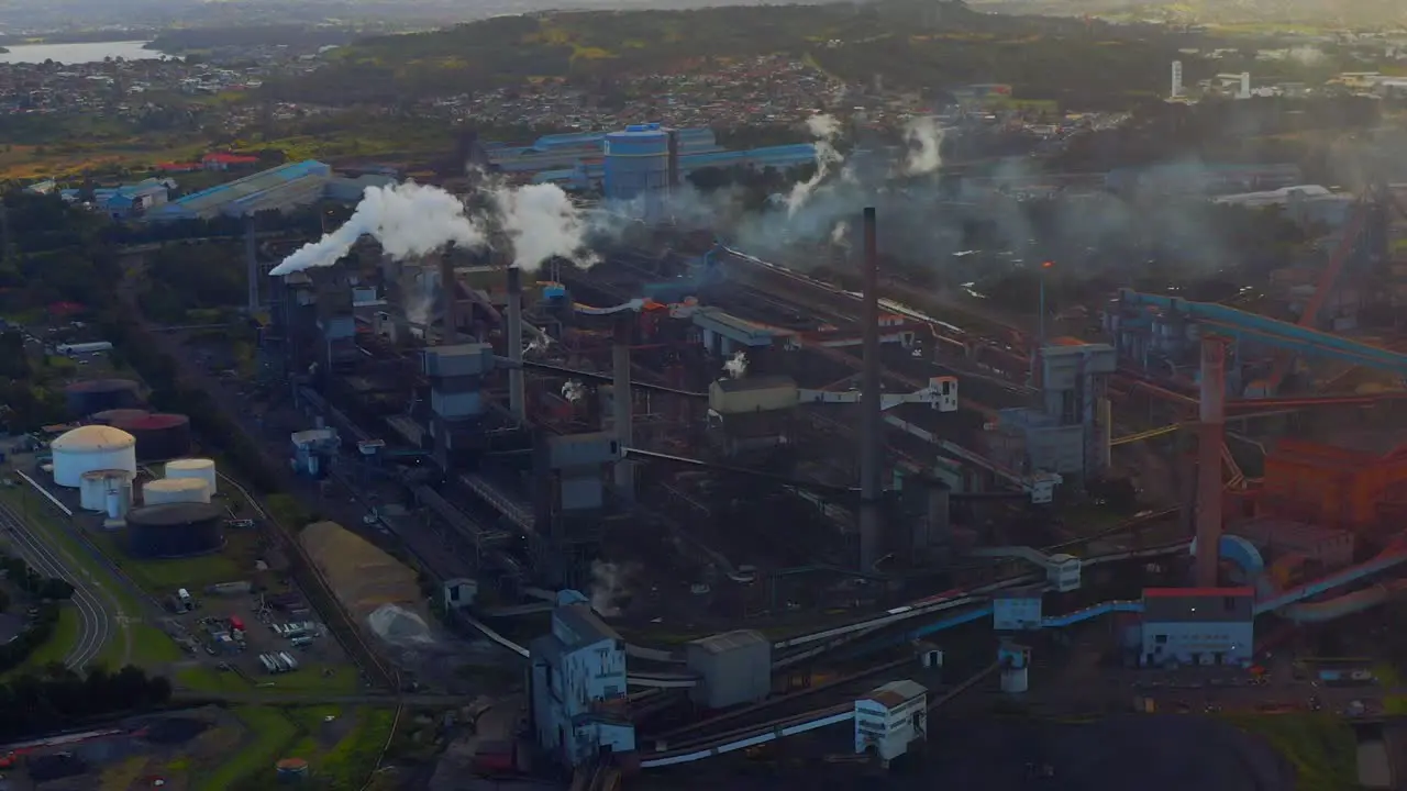 Smoke Rising From Steel Factory in Wollongong Australia aerial shot