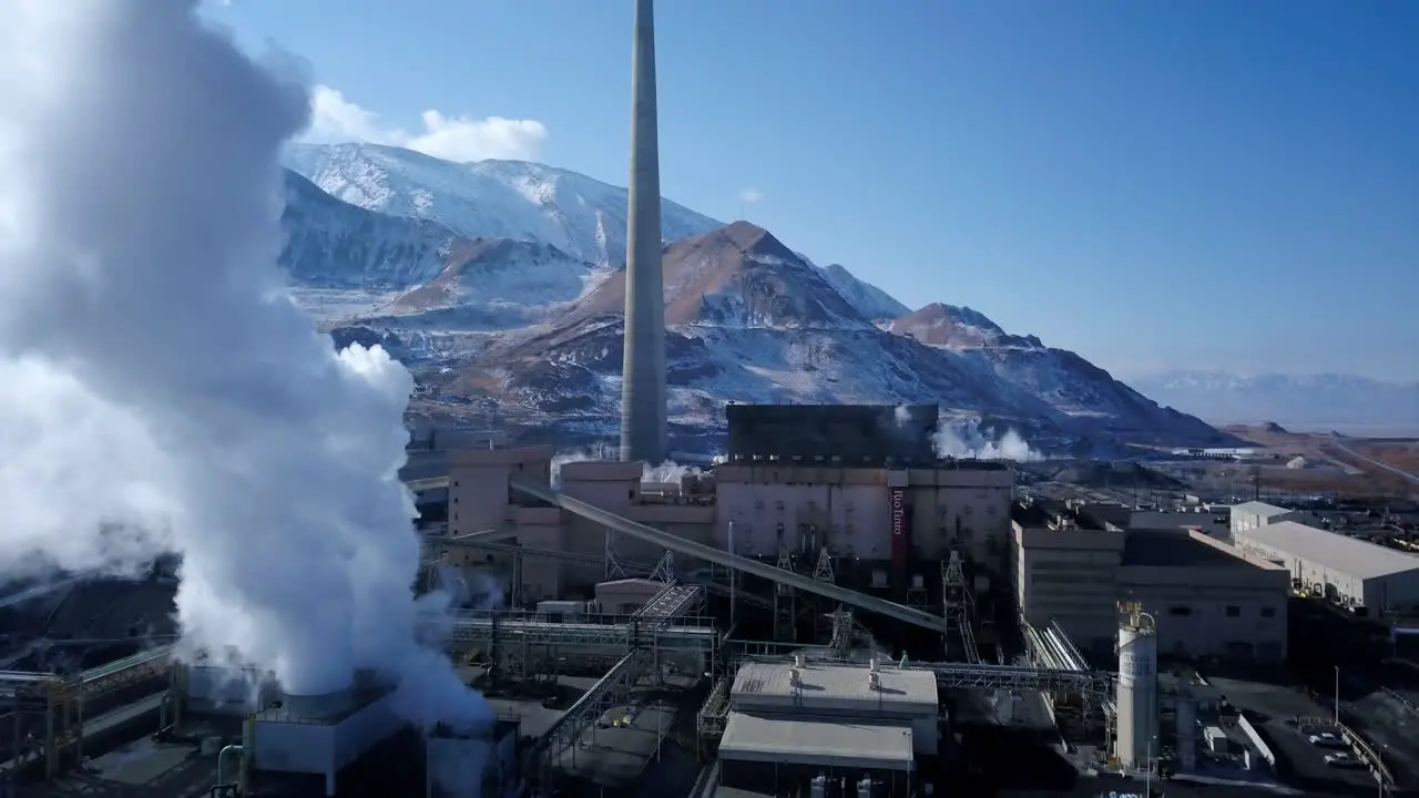 Aerial morning fly over the Kenicott Cooper Mine factory in Magna UT