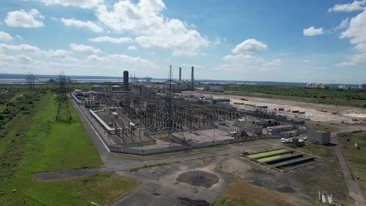 Grain Electrical substation Power station in background Kent UK drone aerial view