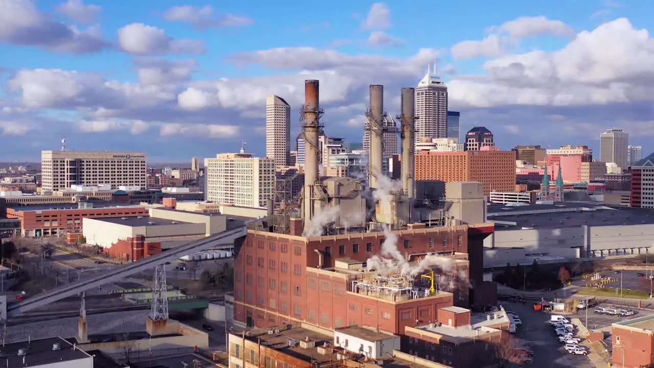 Nice drone aerial of downtown Indianapolis Indiana with industrial factory in foreground 1