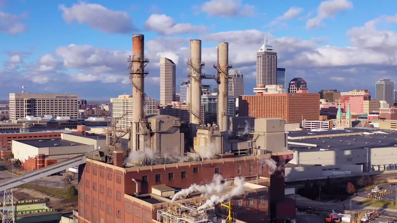 Nice drone aerial of downtown Indianapolis Indiana with industrial factory in foreground 2