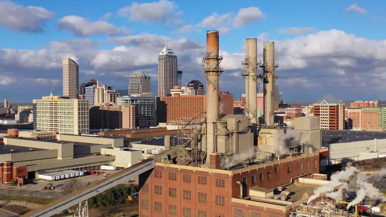 Nice drone aerial of downtown Indianapolis Indiana with industrial factory in foreground 3