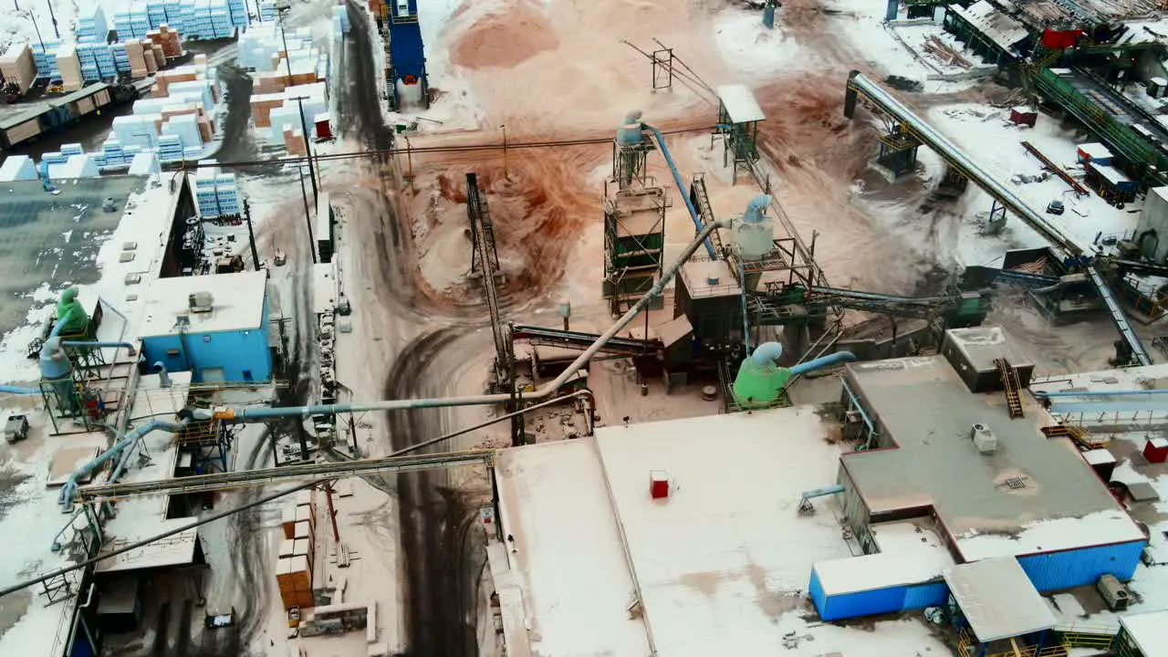 Stunning aerial birds eye view shot of bustling plywood sawmill in action