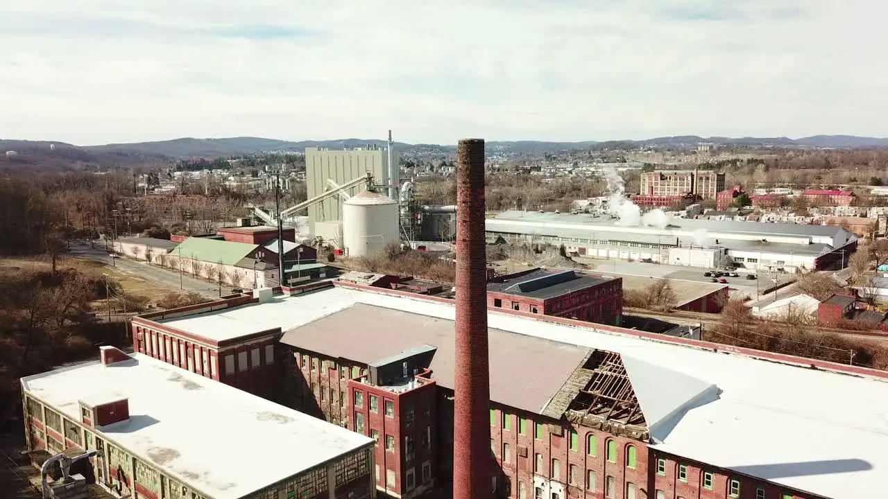 Aerial over an abandoned American factory with smokestack near Reading Pennsylvania 3