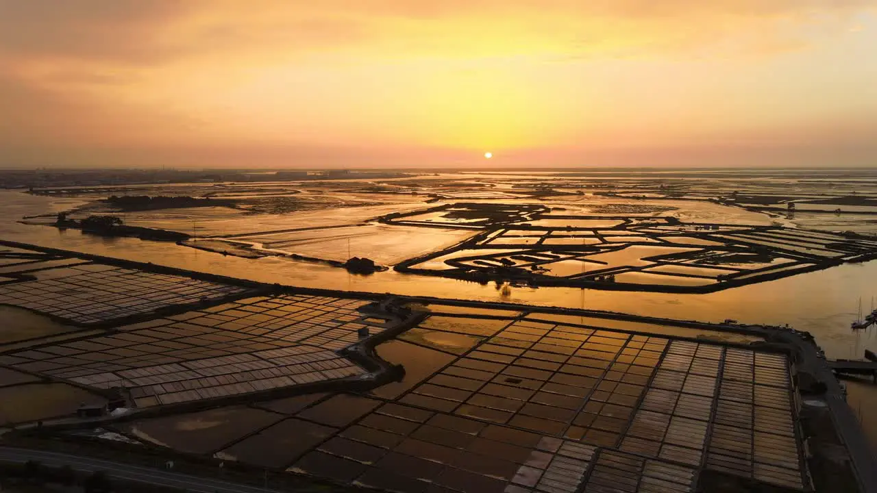 Amazing sunset in the traditional salt plans fields in Aveiro Portugal