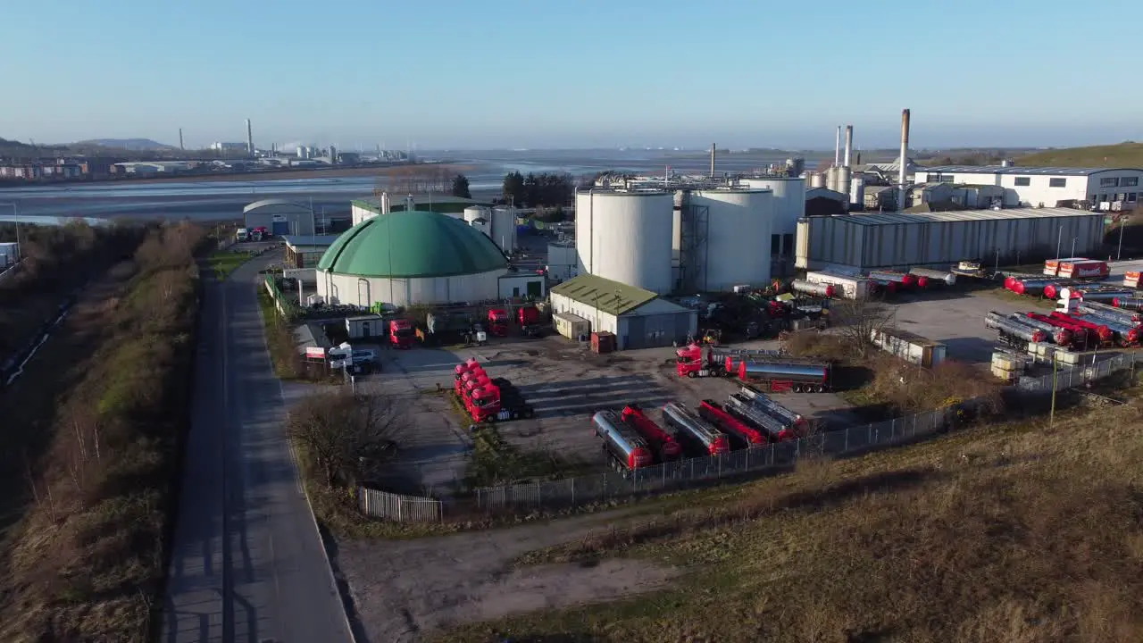 Bio food green fuel agribusiness refinery plant industrial global factory aerial view descending right