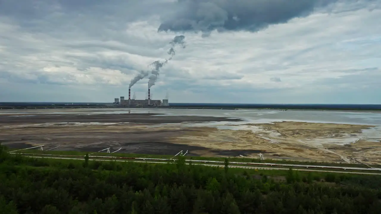 Dark Smoke Rising From Smokestacks Of Industrial Mining Plant