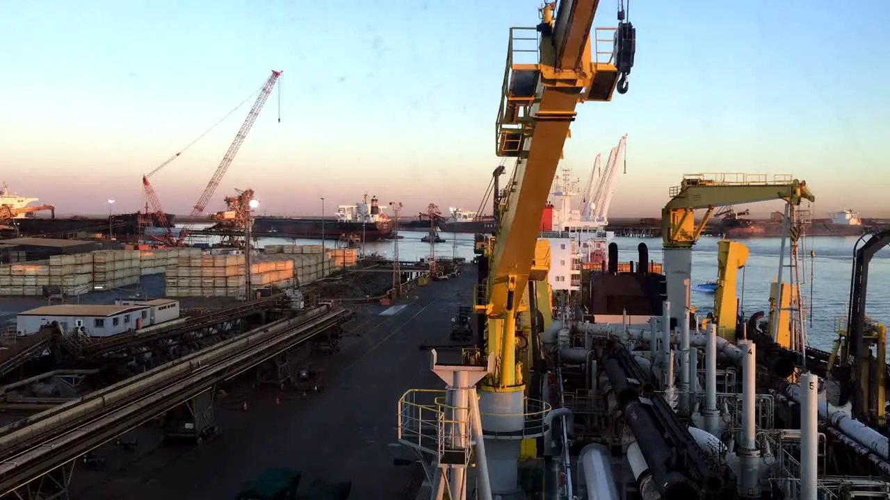 Timelapse of a harbour during sunrise with large