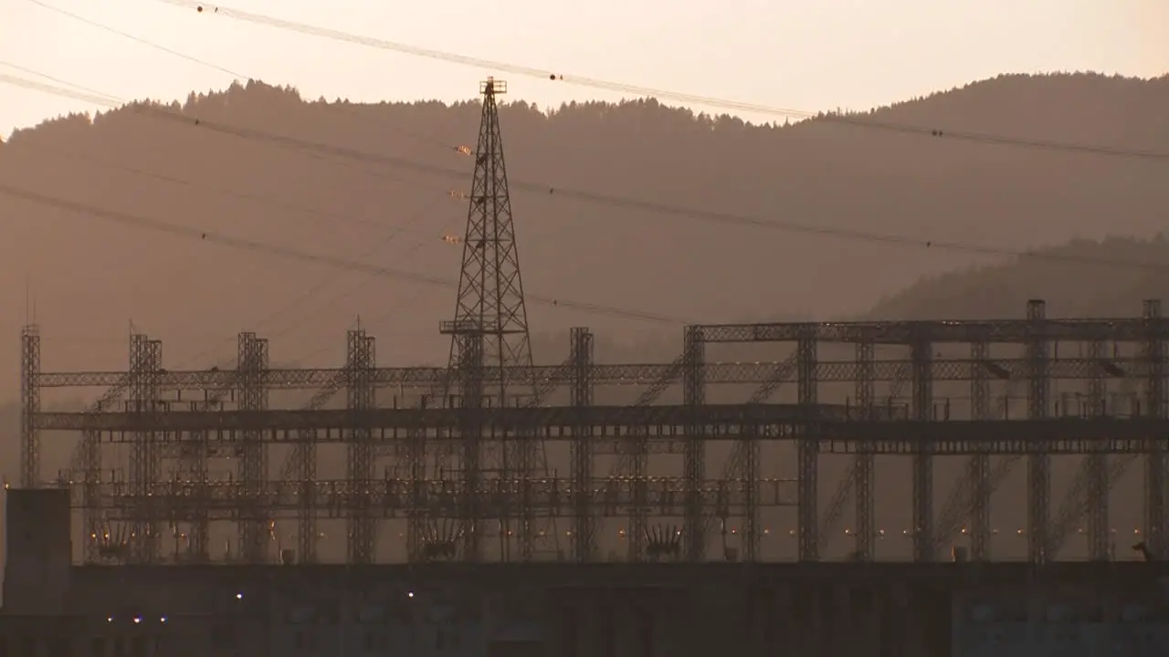 High tension power lines in sunset light