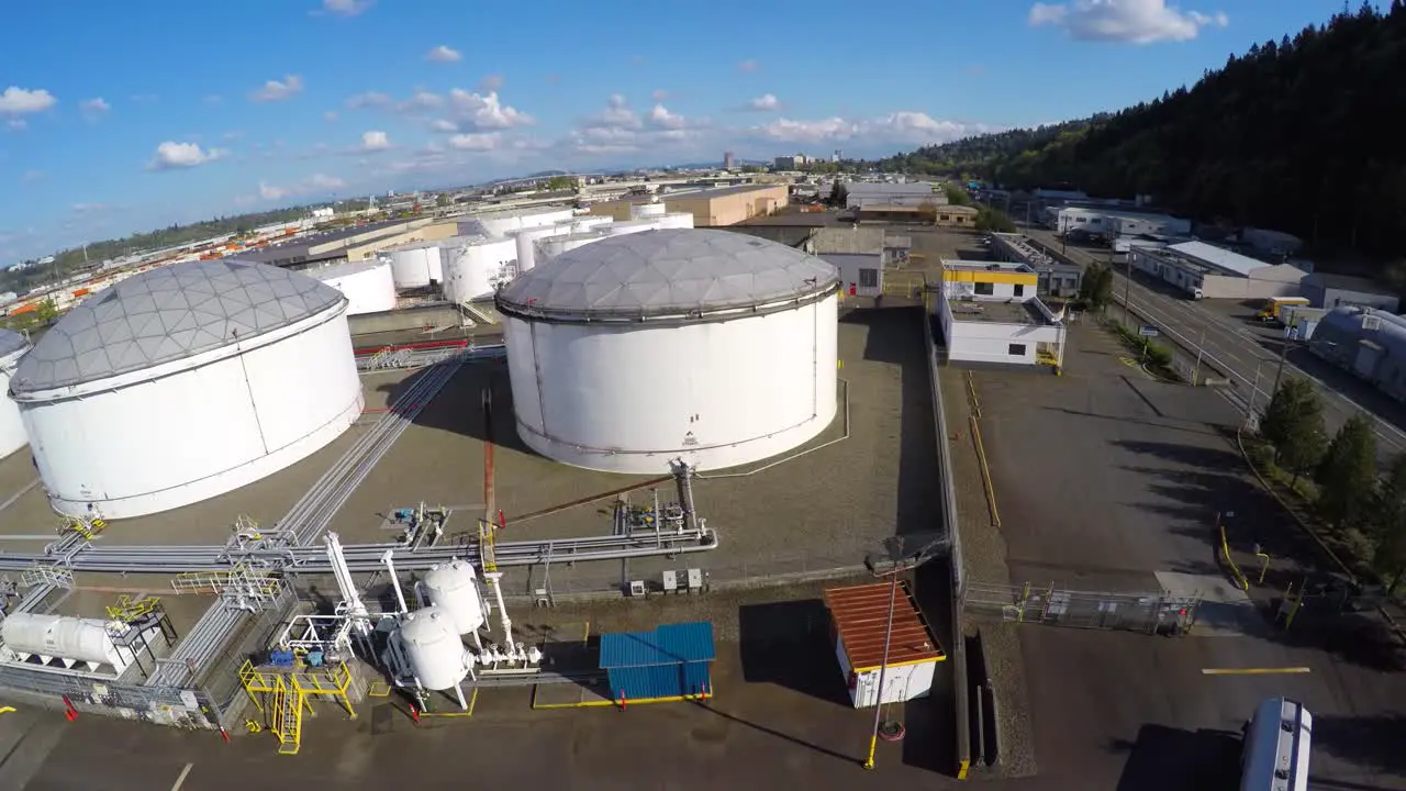 Aerial over oil storage tanks illustrating energy need